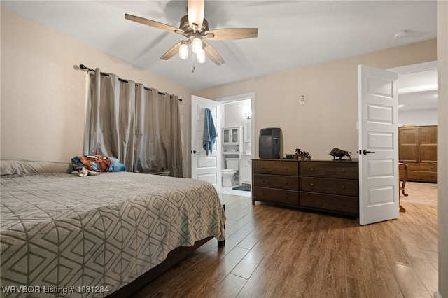 908 N 5th Ter, Barling, AR 72923 - bedroom with wood finished floors, ensuite bath, and a ceiling fan