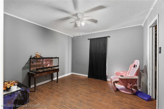 miscellaneous room featuring wood-type flooring, a textured ceiling, ceiling fan, and crown molding