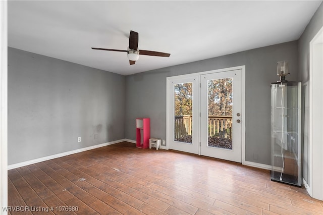 empty room featuring ceiling fan and wood-type flooring