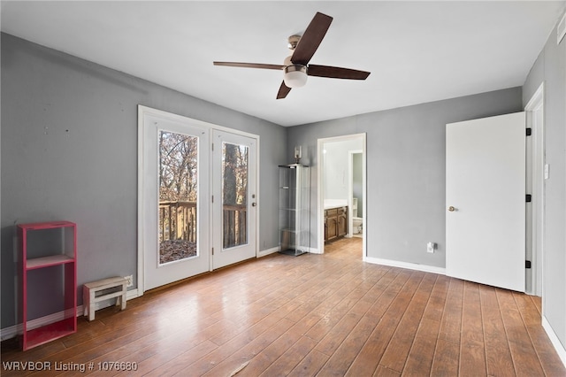 interior space with hardwood / wood-style flooring and ceiling fan