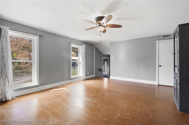 unfurnished living room with ceiling fan and dark hardwood / wood-style floors