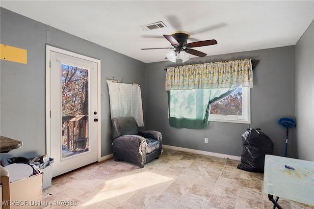 living area featuring ceiling fan