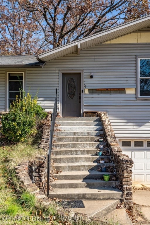 entrance to property featuring a garage