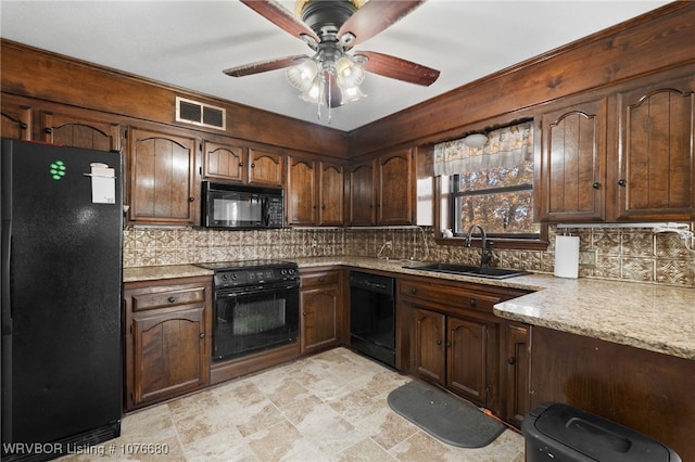 kitchen featuring ceiling fan, sink, backsplash, dark brown cabinets, and black appliances