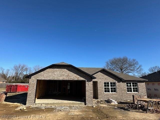 unfinished property featuring a garage