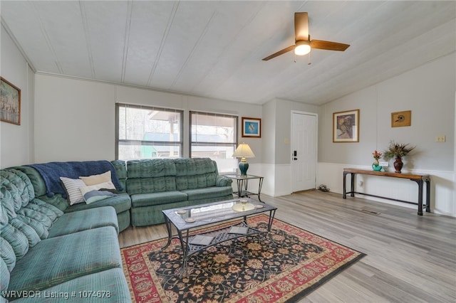 living room with ceiling fan and light wood-type flooring