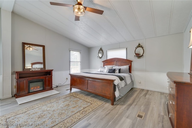 bedroom featuring ceiling fan, wood ceiling, lofted ceiling, and light wood-type flooring