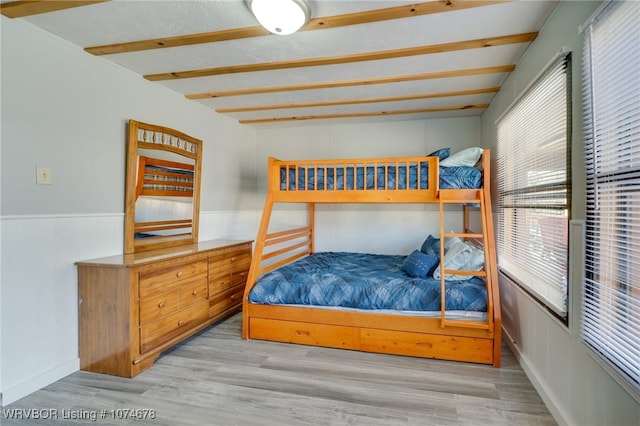 bedroom featuring light hardwood / wood-style floors and multiple windows