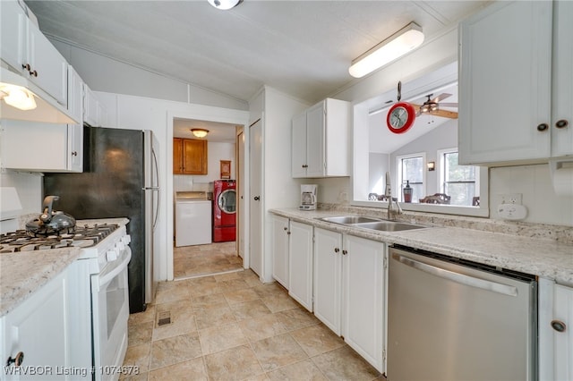 kitchen featuring stainless steel dishwasher, white range with gas cooktop, sink, white cabinets, and lofted ceiling