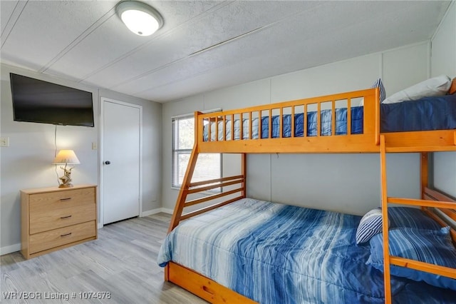 bedroom with light hardwood / wood-style floors