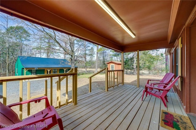 wooden deck featuring a storage shed