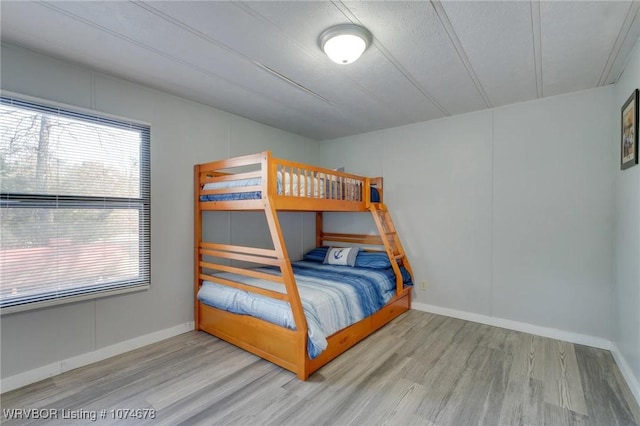 bedroom with hardwood / wood-style flooring