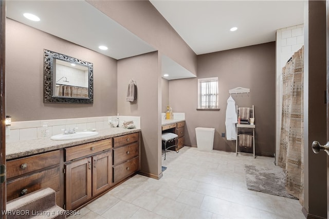 bathroom with a shower with curtain and vanity