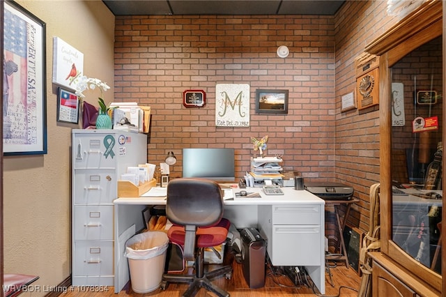 office space featuring brick wall