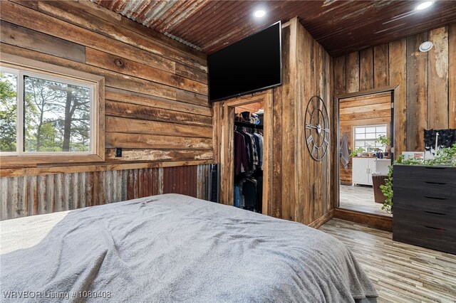 1450 Ulmer St, Greenwood, AR 72936 - bathroom featuring wood finished floors, a shower stall, wooden ceiling, vanity, and stacked washing maching and dryer