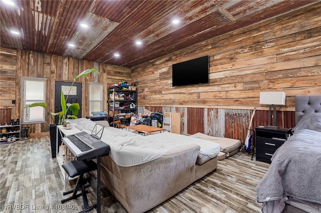 1450 Ulmer St, Greenwood, AR 72936 - bedroom with wooden walls, recessed lighting, and hardwood / wood-style flooring