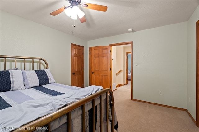 1450 Ulmer St, Greenwood, AR 72936 - bedroom with ceiling fan, light carpet, and baseboards