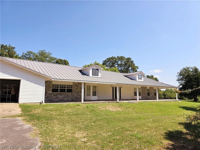 view of front of home with a front lawn and covered porch