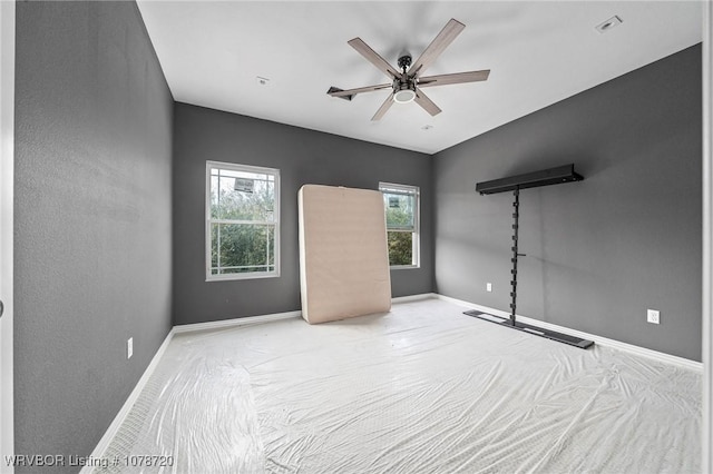 unfurnished bedroom with light colored carpet and ceiling fan