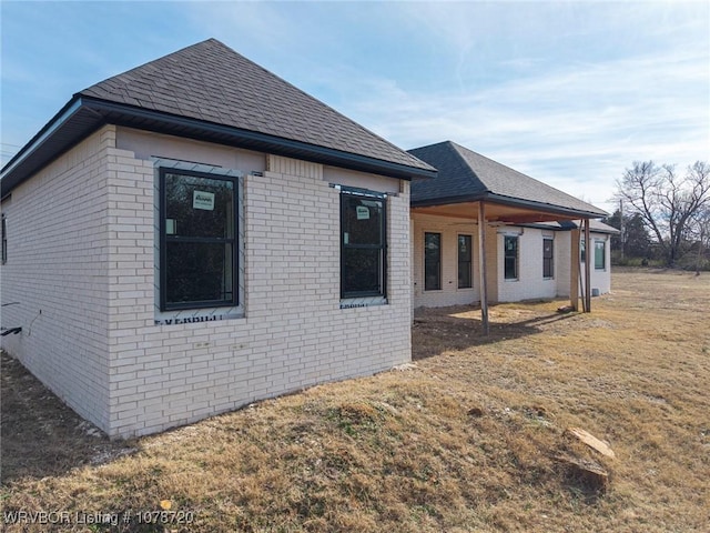 view of property exterior with a lawn