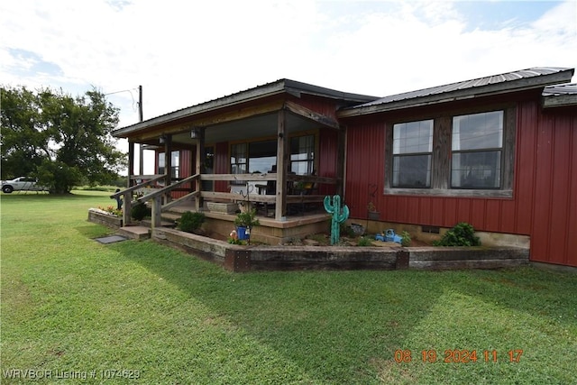 exterior space with a yard and a porch