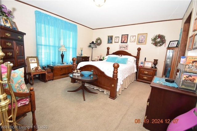 bedroom featuring light colored carpet and crown molding