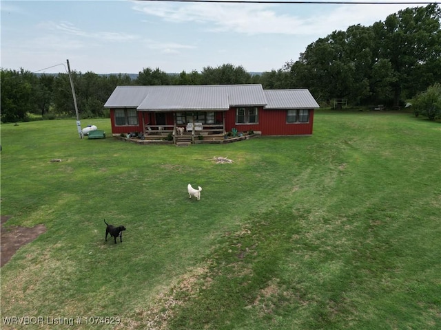 exterior space featuring a front lawn and covered porch