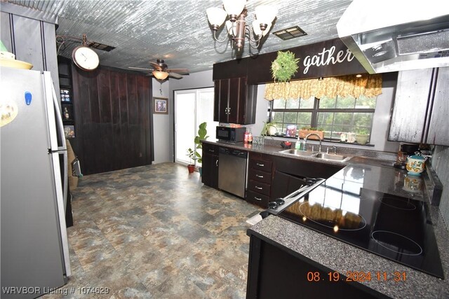 kitchen featuring ceiling fan with notable chandelier, dark brown cabinets, sink, and black appliances