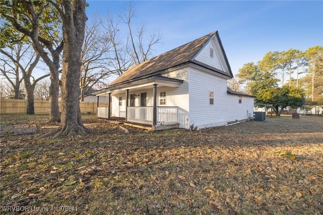 411 N Logan St, Charleston, AR 72933 - view of side of property with cooling unit and covered porch