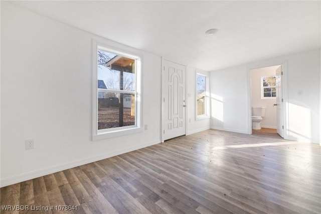 411 N Logan St, Charleston, AR 72933 - interior space with plenty of natural light and wood-type flooring
