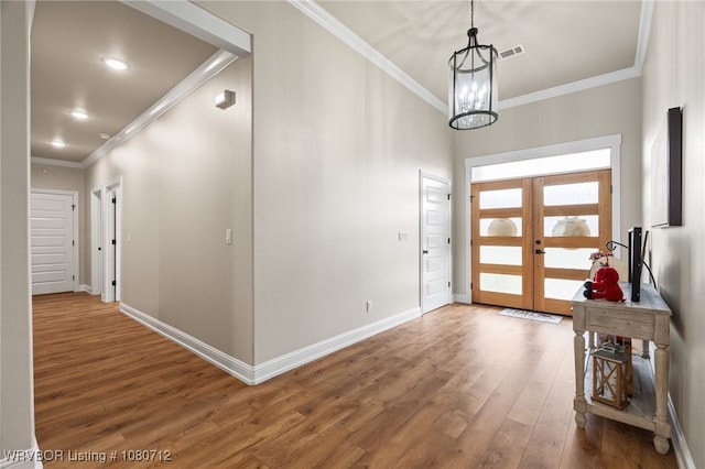 4100 Margate Dr, Fort Smith, AR 72903 - entryway with visible vents, wood finished floors, baseboards, an inviting chandelier, and ornamental molding