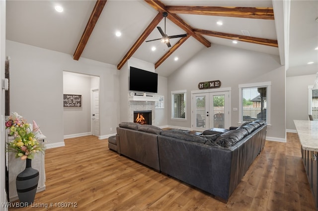 4100 Margate Dr, Fort Smith, AR 72903 - living room featuring high vaulted ceiling, recessed lighting, light wood-type flooring, beamed ceiling, and a lit fireplace