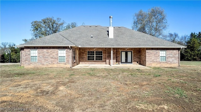 471144 1060th Rd, Muldrow, OK 74948 - rear view of house with brick siding, a patio, and roof with shingles