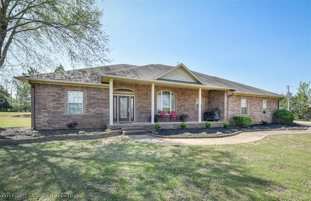 471144 1060th Rd, Muldrow, OK 74948 - ranch-style house with a porch, a front yard, and brick siding
