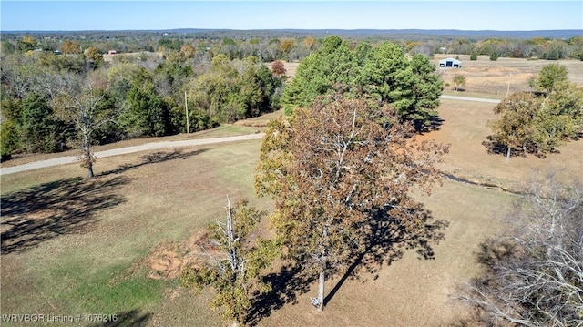 birds eye view of property with a rural view