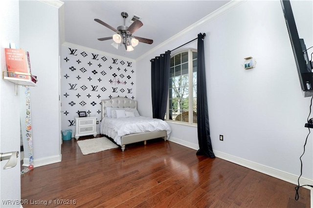 bedroom featuring ceiling fan, crown molding, and dark wood-type flooring