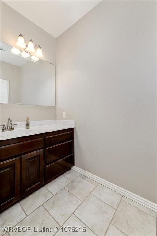 bathroom with vanity and tile patterned floors