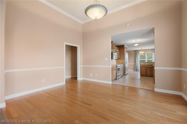 unfurnished living room with light wood-type flooring and crown molding