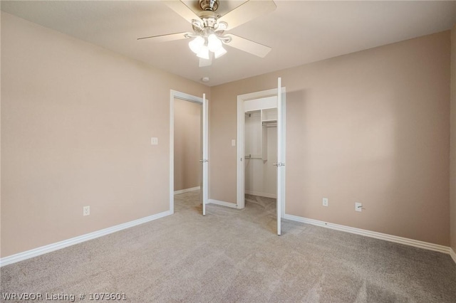 unfurnished bedroom with ceiling fan, a closet, and light carpet