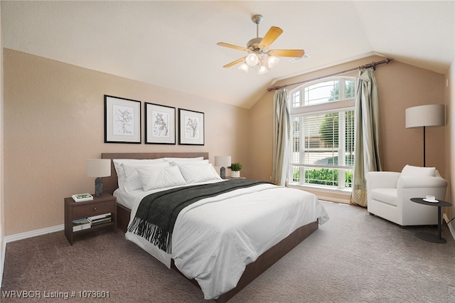 bedroom with carpet flooring, ceiling fan, and vaulted ceiling