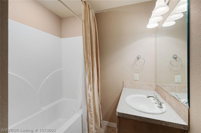 bathroom featuring vanity and shower / tub combo