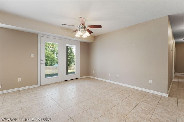 empty room with light tile patterned floors and ceiling fan