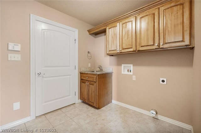 clothes washing area with sink, cabinets, hookup for an electric dryer, hookup for a washing machine, and a textured ceiling