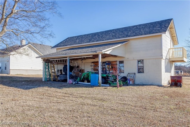 rear view of house with a yard