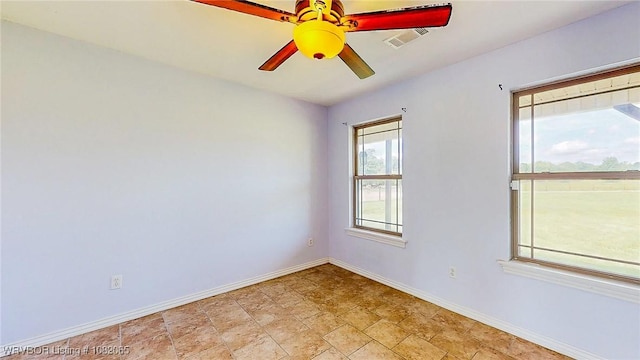 6562 Broadleaf Dr, Alma, AR 72921 - empty room with ceiling fan and light stone finish floors