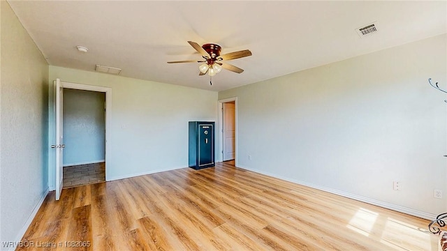 6562 Broadleaf Dr, Alma, AR 72921 - empty room featuring light wood-style flooring and ceiling fan