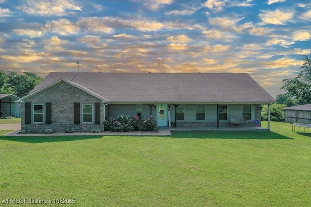 6562 Broadleaf Dr, Alma, AR 72921 - view of front of house featuring a yard, a trampoline, a carport, and a porch