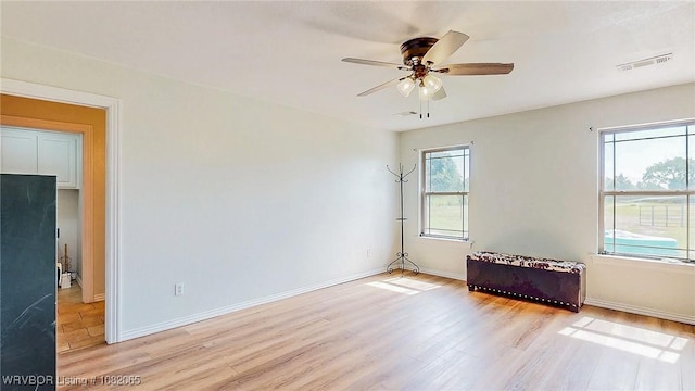 6562 Broadleaf Dr, Alma, AR 72921 - spare room featuring light wood-style floors and ceiling fan