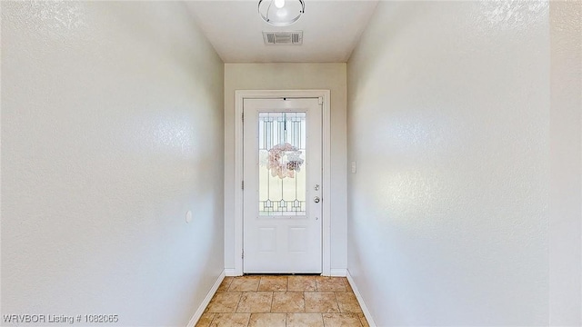 6562 Broadleaf Dr, Alma, AR 72921 - doorway to outside featuring baseboards and light stone finish floors