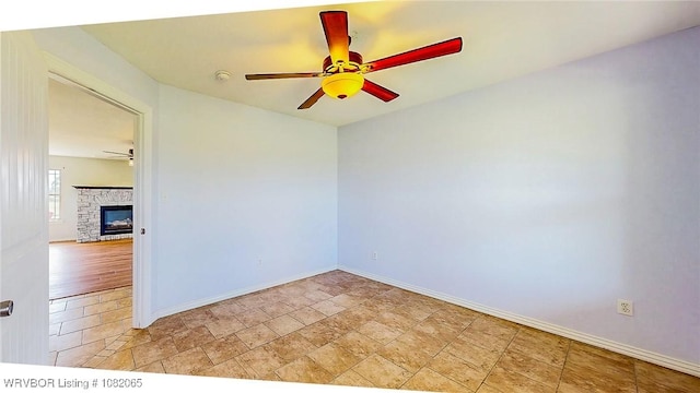 6562 Broadleaf Dr, Alma, AR 72921 - unfurnished room featuring ceiling fan, a fireplace, and a smoke detector